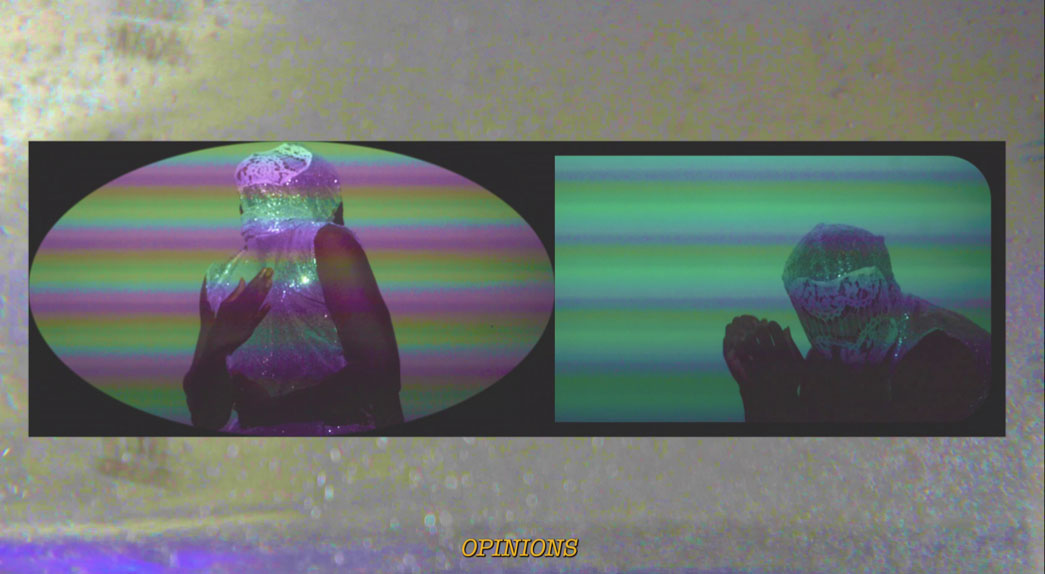 A person wrapped in plastic stands in two panels with colourful, horizontal stripes. The mood is surreal and mysterious. Text below reads “OPINIONS.”